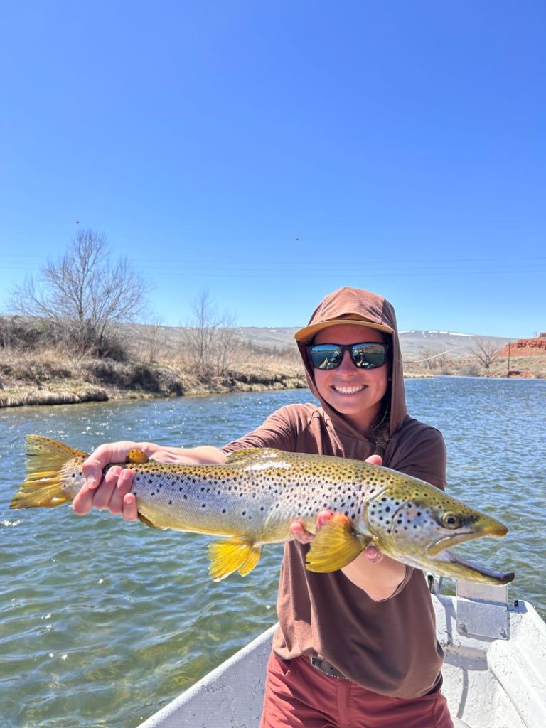 Karissa with nice Brown Trout on a fly rod. While fly fishing the Bighorn River in Wyoming.