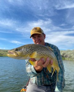 Sam with a nice brown on a dry fly.