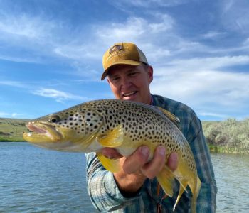 Sam with a nice brown on a dry fly.